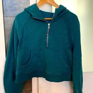 Dark green cropped Lululemon hooded sweatshirt
